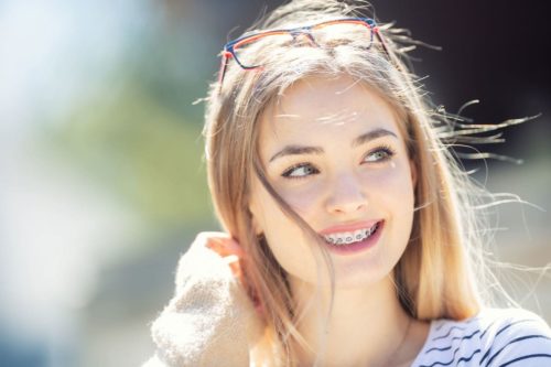 Girl with braces smiling.